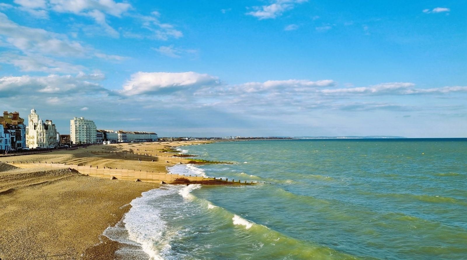 The seafront and beach at Eastbourne on a bright day